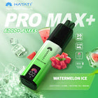 A prefilled pod kit vape with a green color labeled 'Hayati Pro Max Plus 6000 Puffs' with additional flavoring, ice cubes, and watermelon slices depicted in the background.